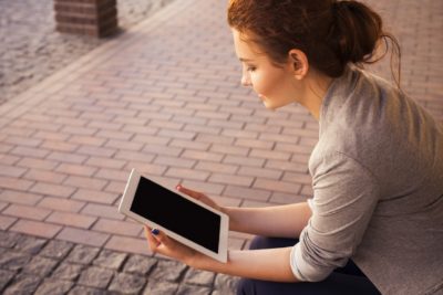 Woman reading tablet