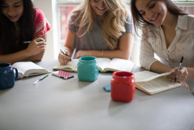 Three women reading the Bible