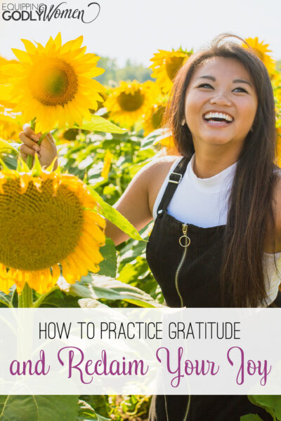 Woman in a sunflower field showing how to practice gratitude and reclaim your joy.