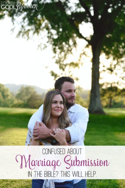 Marriage Submission with man standing behind a woman with his arms around her