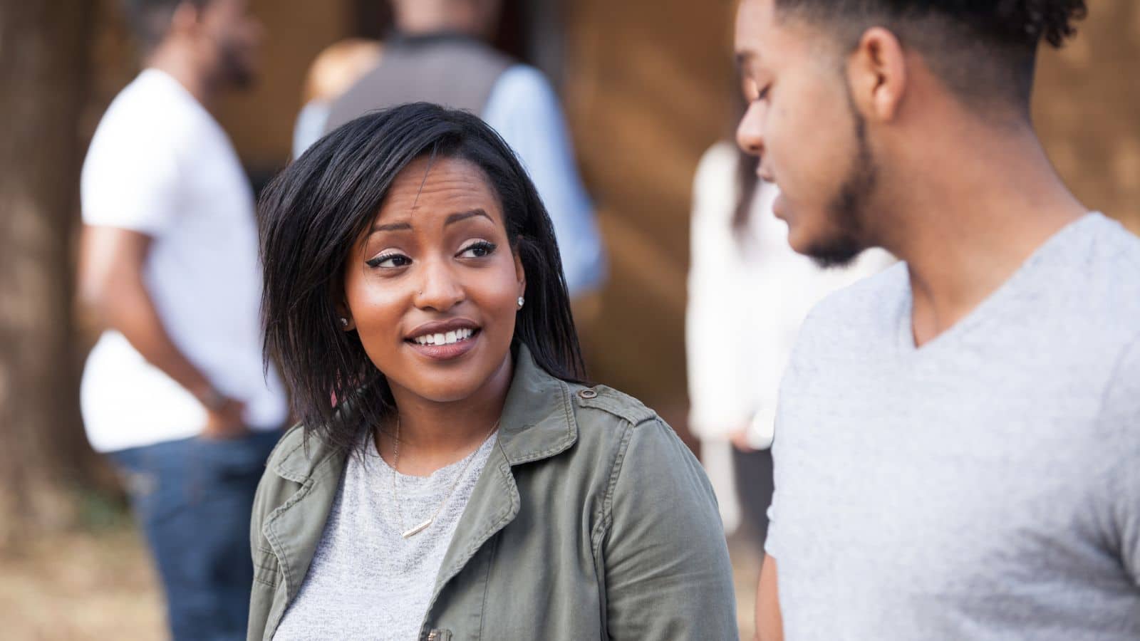 Woman looking at man with unhappy expression