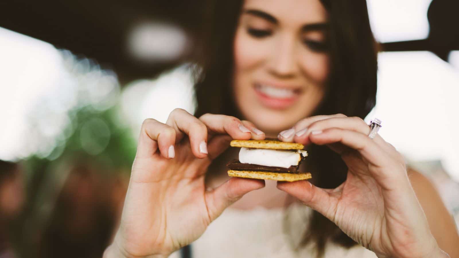 Woman about to eat a smore