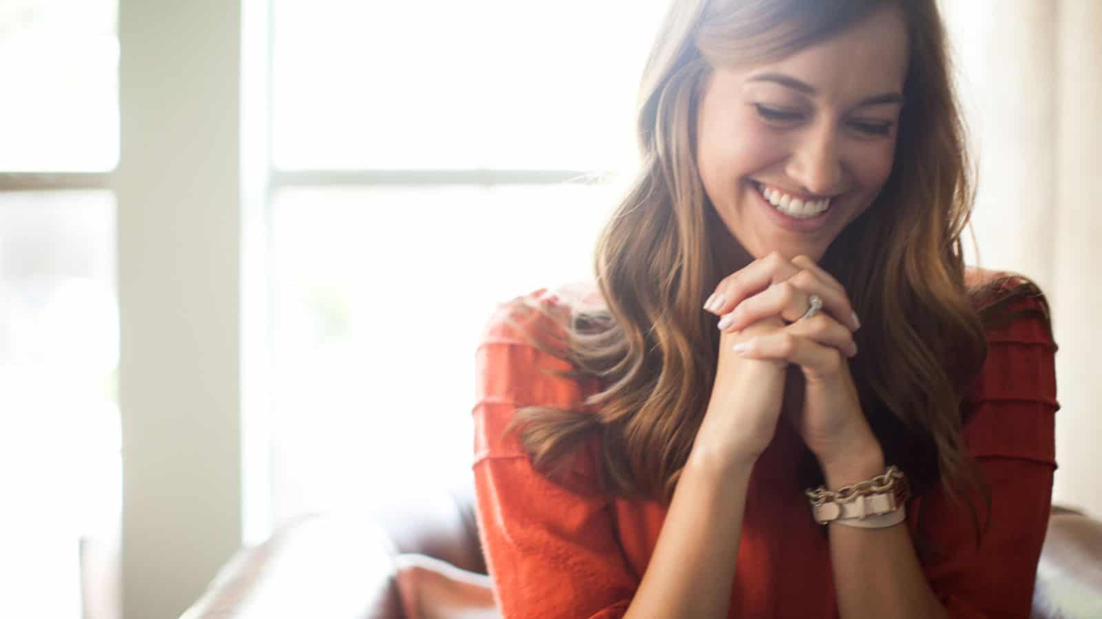 Woman smiling in prayer