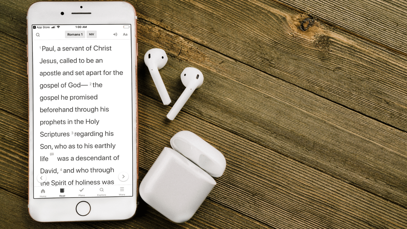 Phone with Bible app and ear pods