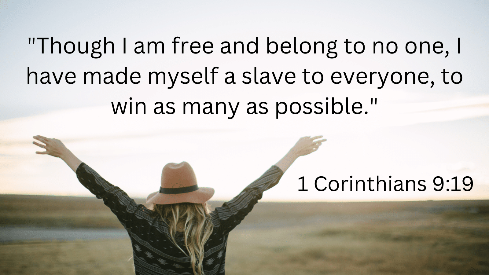 Woman with raised hands in a field with 1 Corinthians 9:19