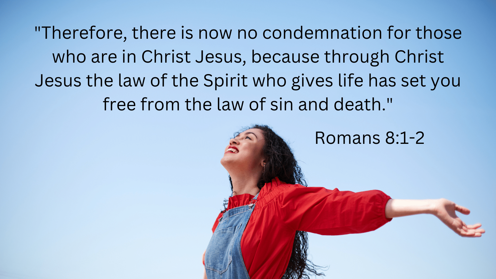 Woman with arms in the air with Romans 8:1-2