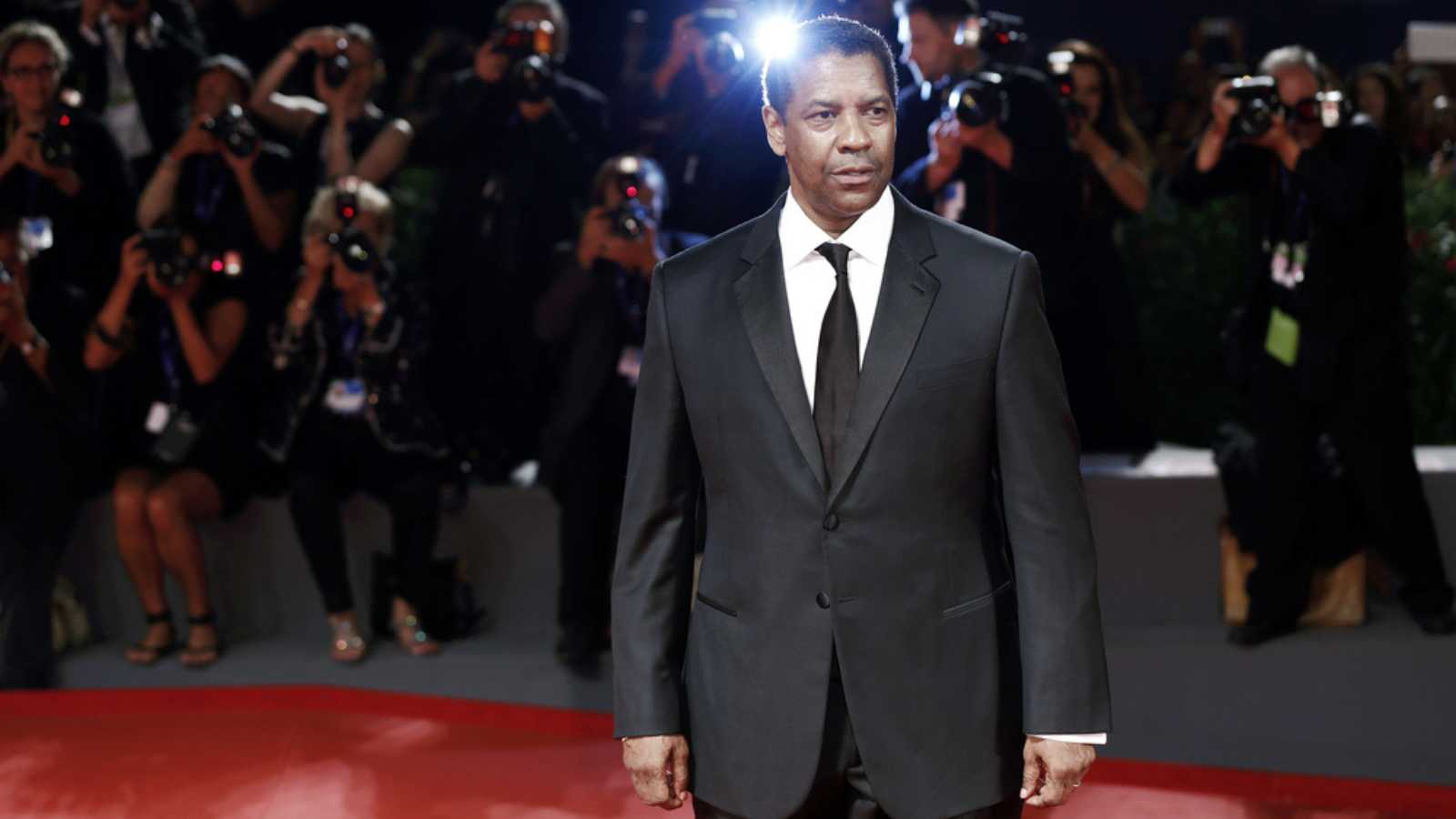 VENICE, ITALY - SEPTEMBER 10: Denzel Washington attends the premiere of 'The Magnificent Seven' during the 73rd Venice Film Festival on September 10, 2016 in Venice, Italy.