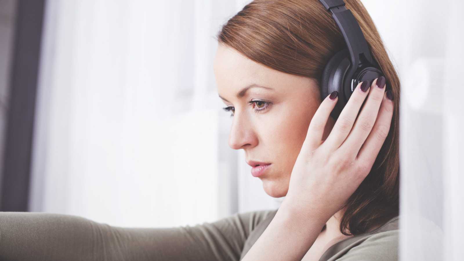 Woman hearing music and feeling emotional