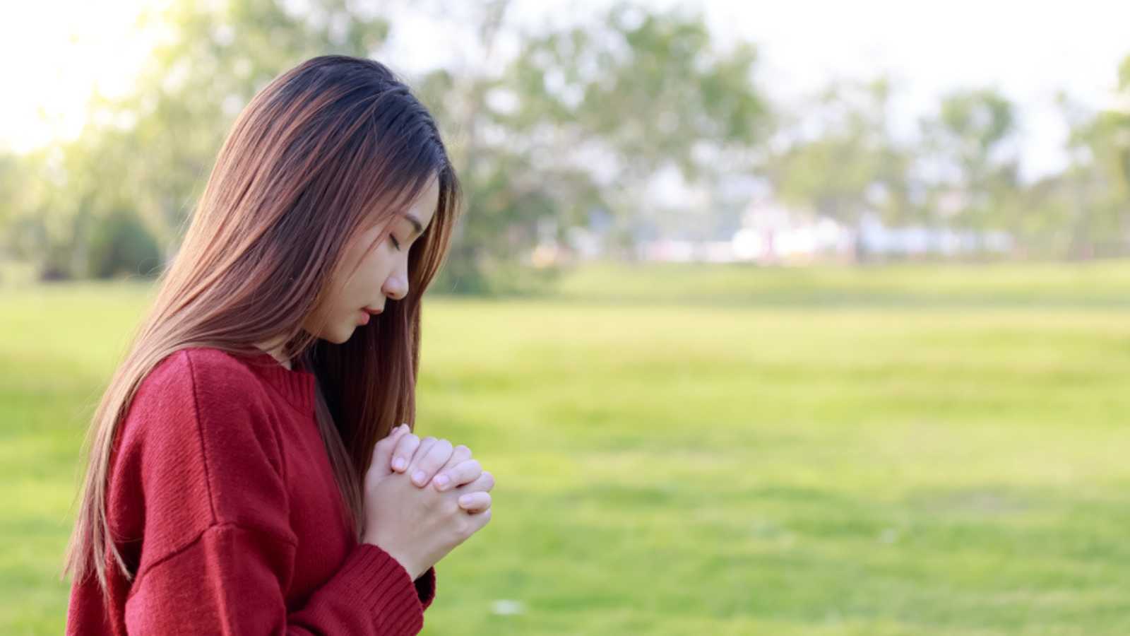 Woman praying in morning and walking