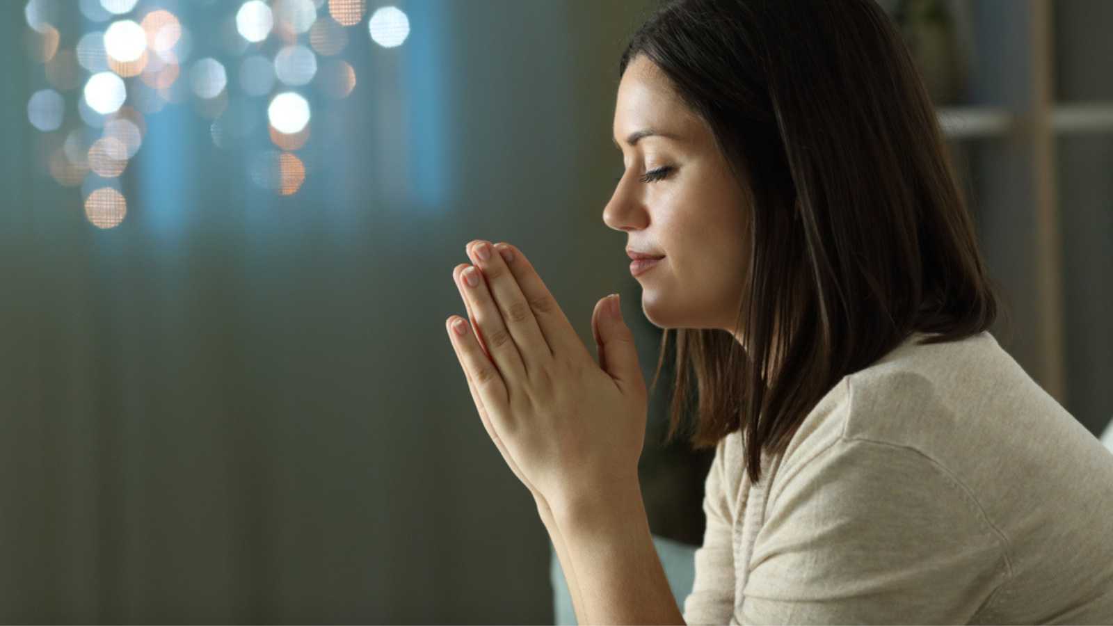 Woman saying prayer