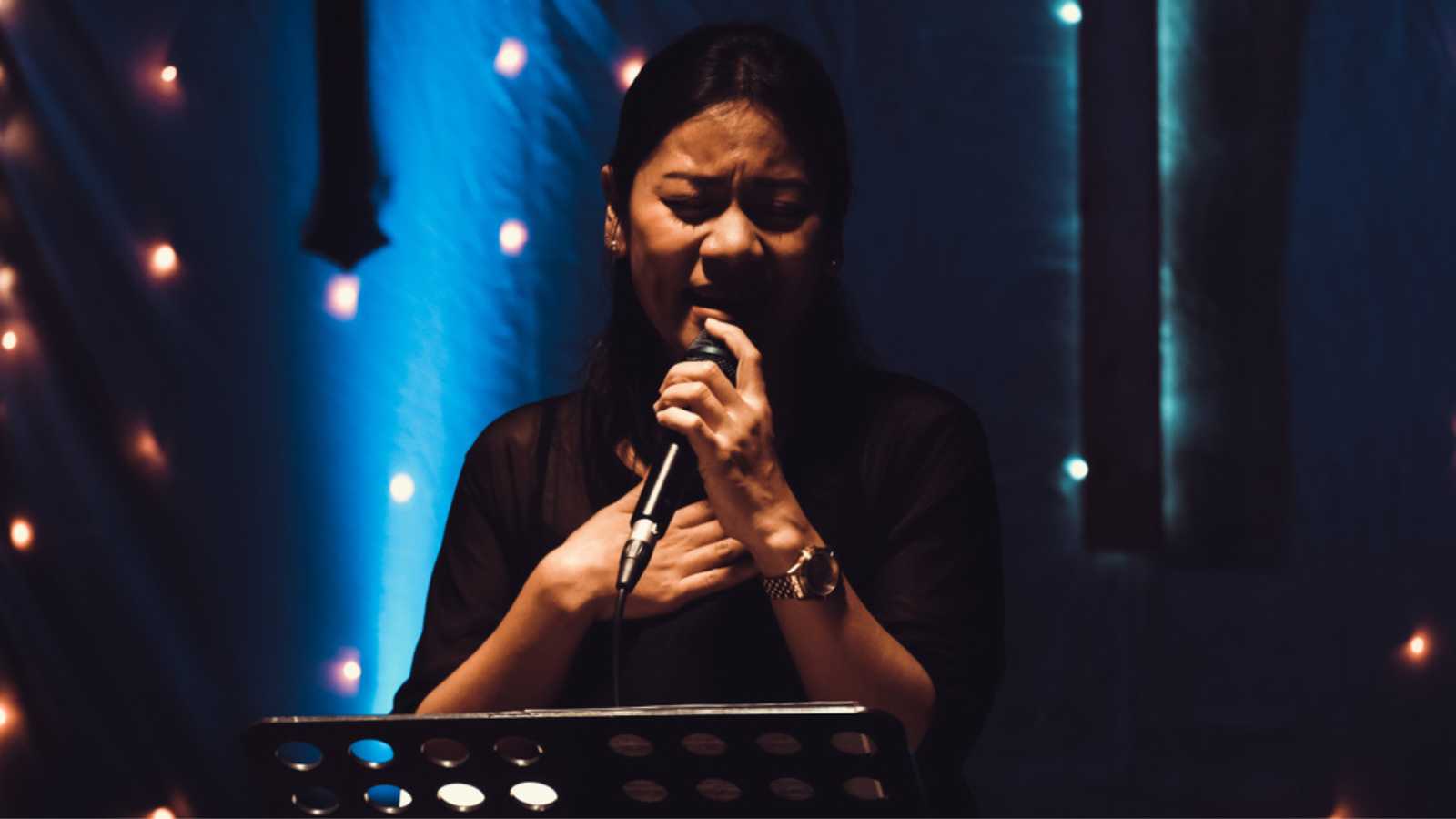 Woman singing during church prayer