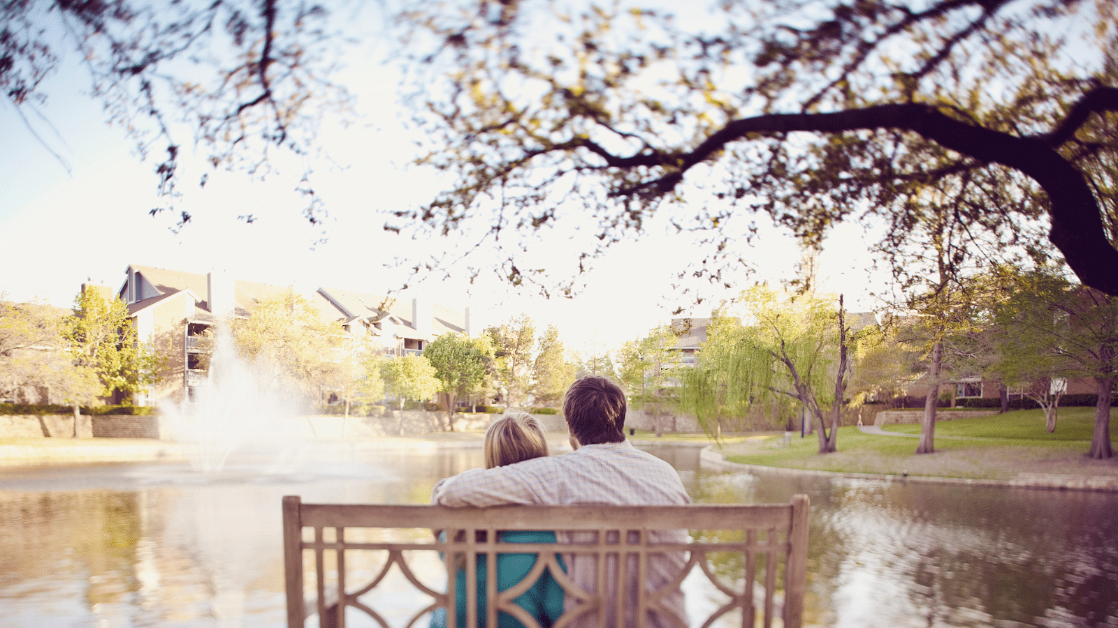 couple at park overlooking pond