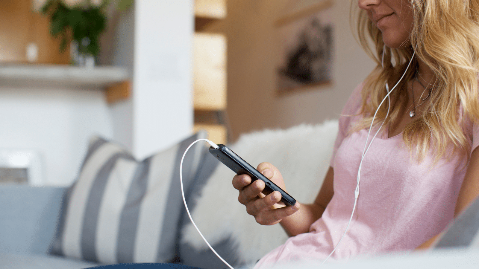 woman listening to Christian podcast on tablet