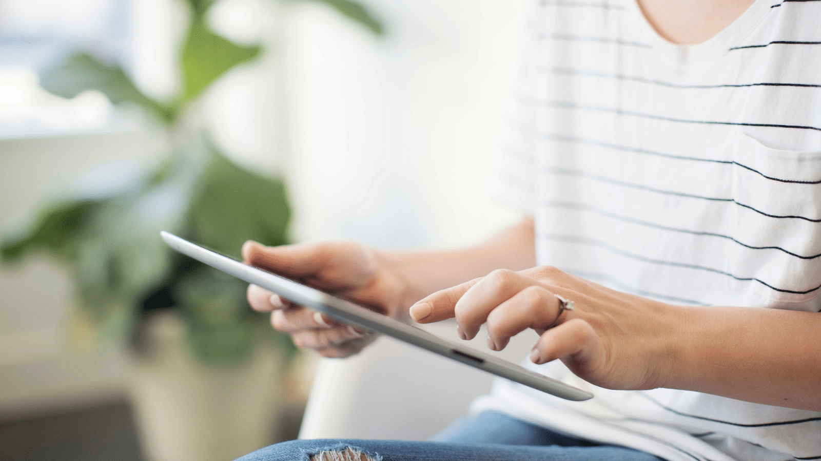 woman watching youtube on tablet