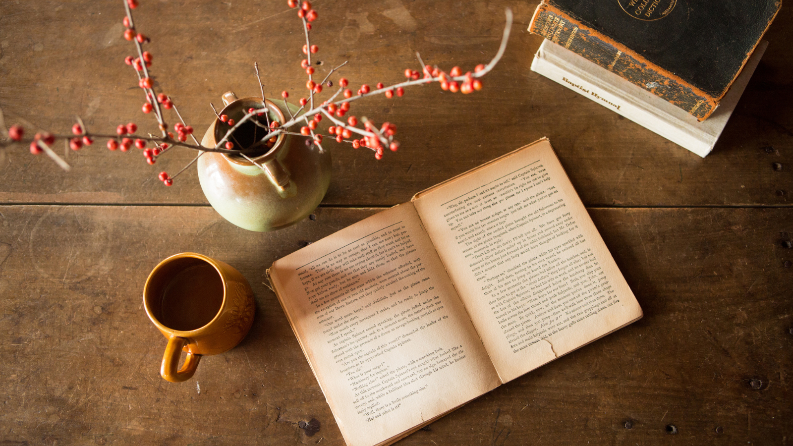 book with coffee cup on table