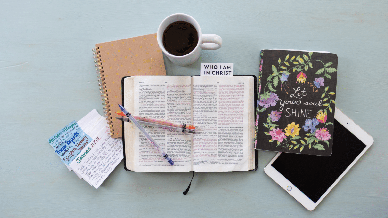 Pile of Bible, journal, books and coffee