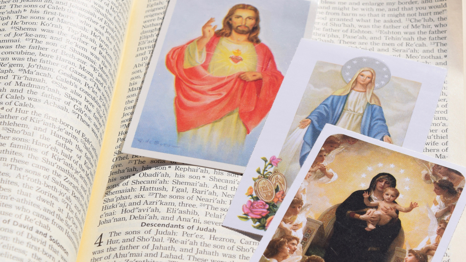 catholic saint cards on Bible