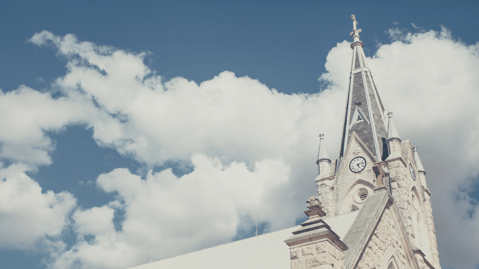 church steeple with clouds in background