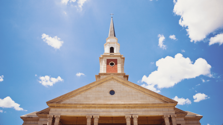 church steeple with clouds in background