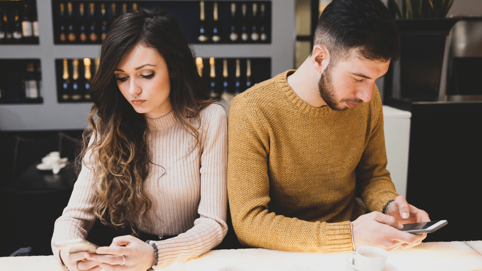 married couple distracted on phones