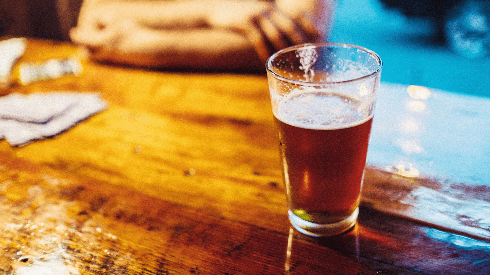 pint of beer on a wooden table