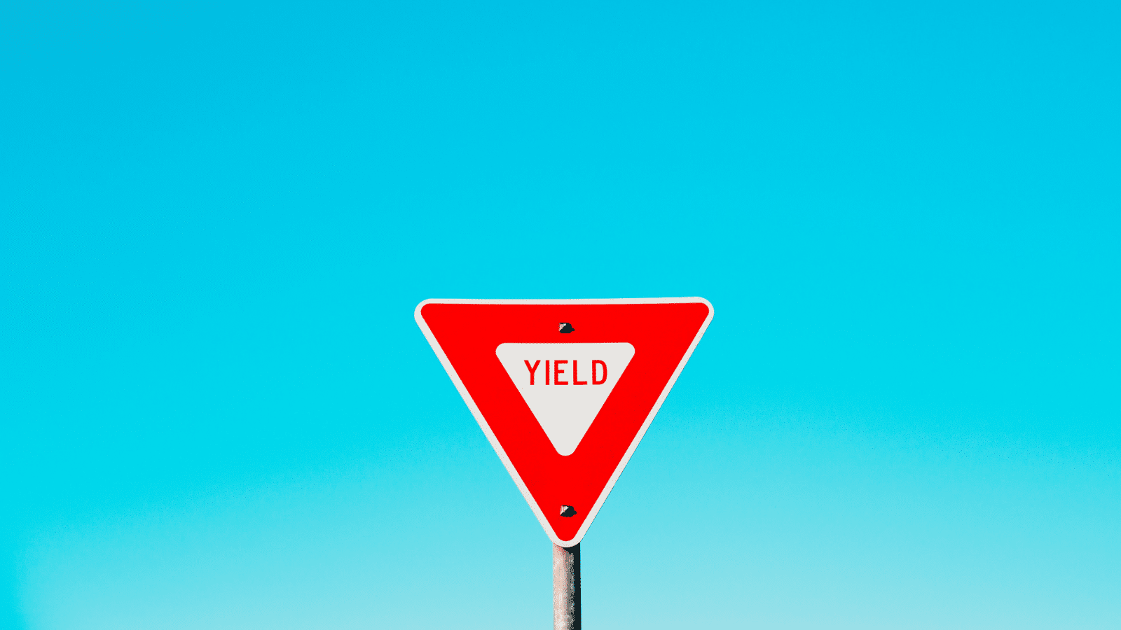 yield sign on blue background