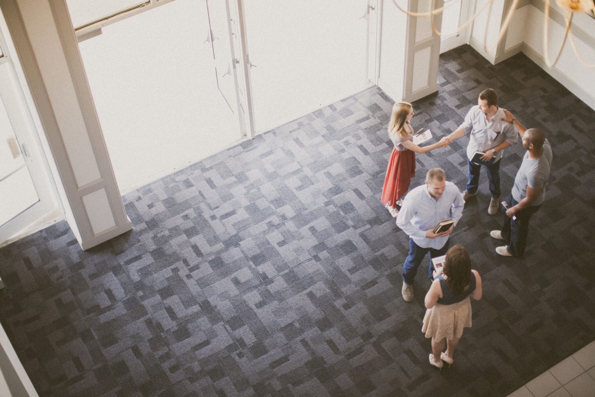 welcoming people in church lobby