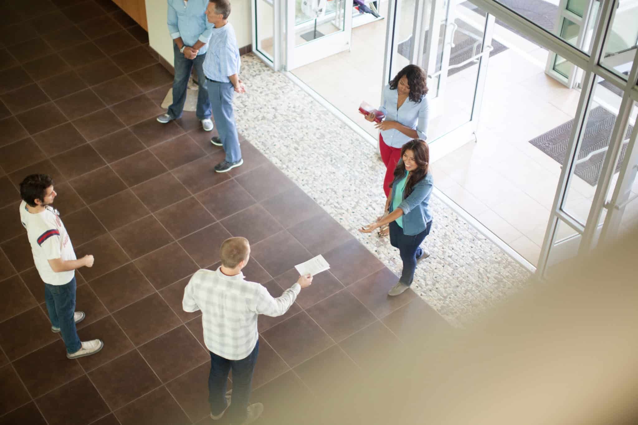 welcoming people in church lobby