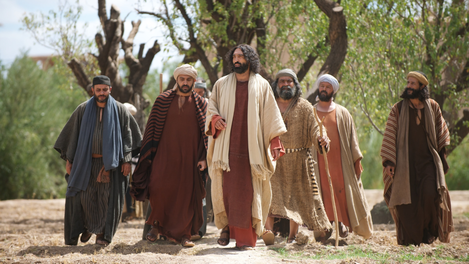 Jesus walking with his apostles.