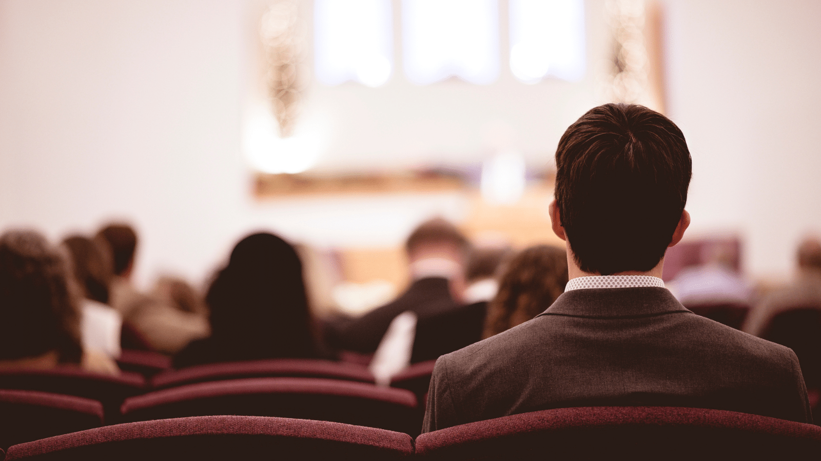 People sitting at church during a service.