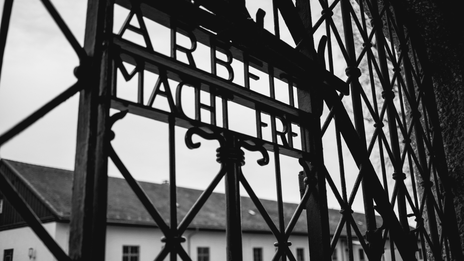 Black gates outside of a prision camp.