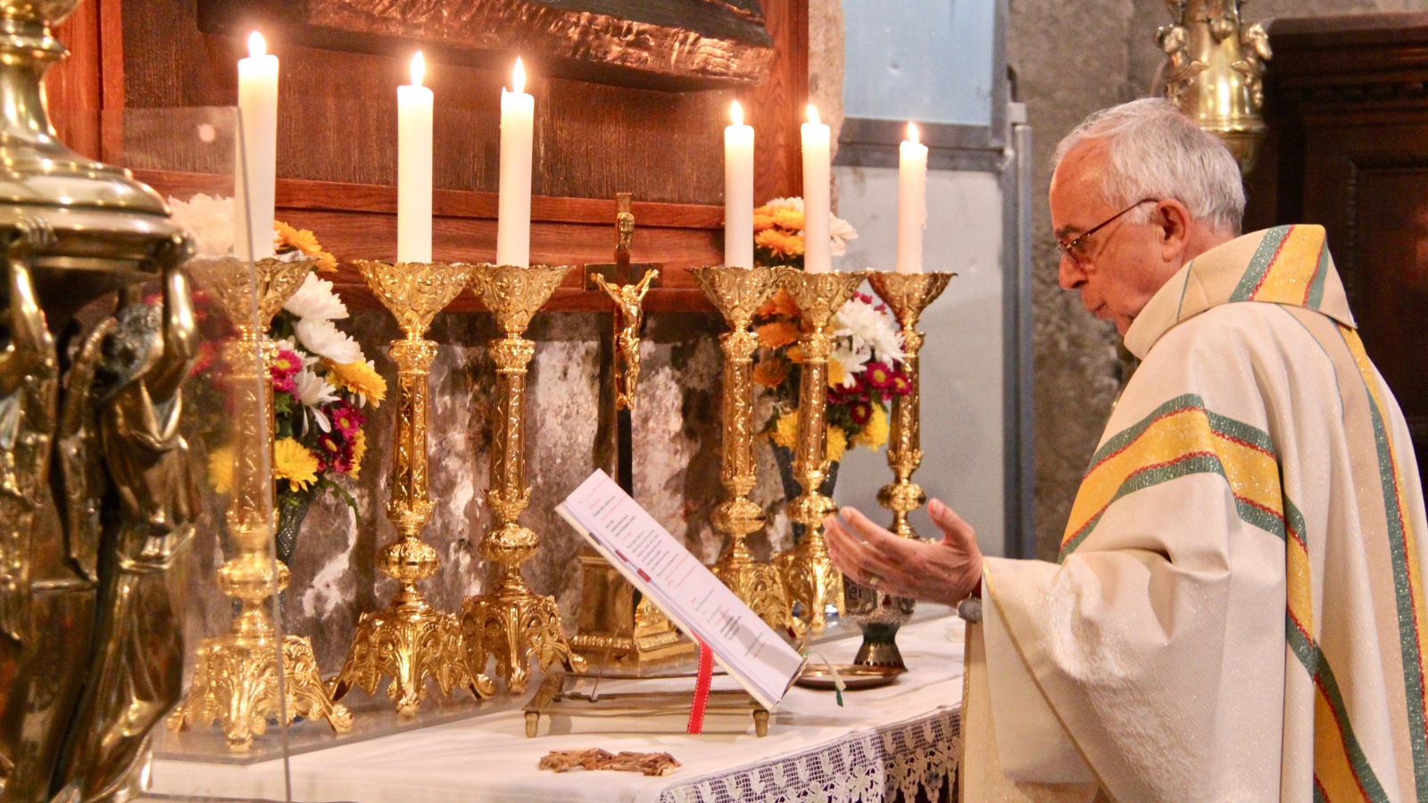 A catholic preist at mass.