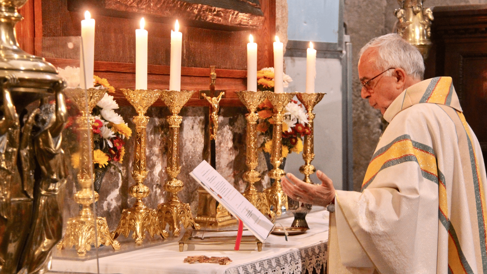 A catholic priest at mass.