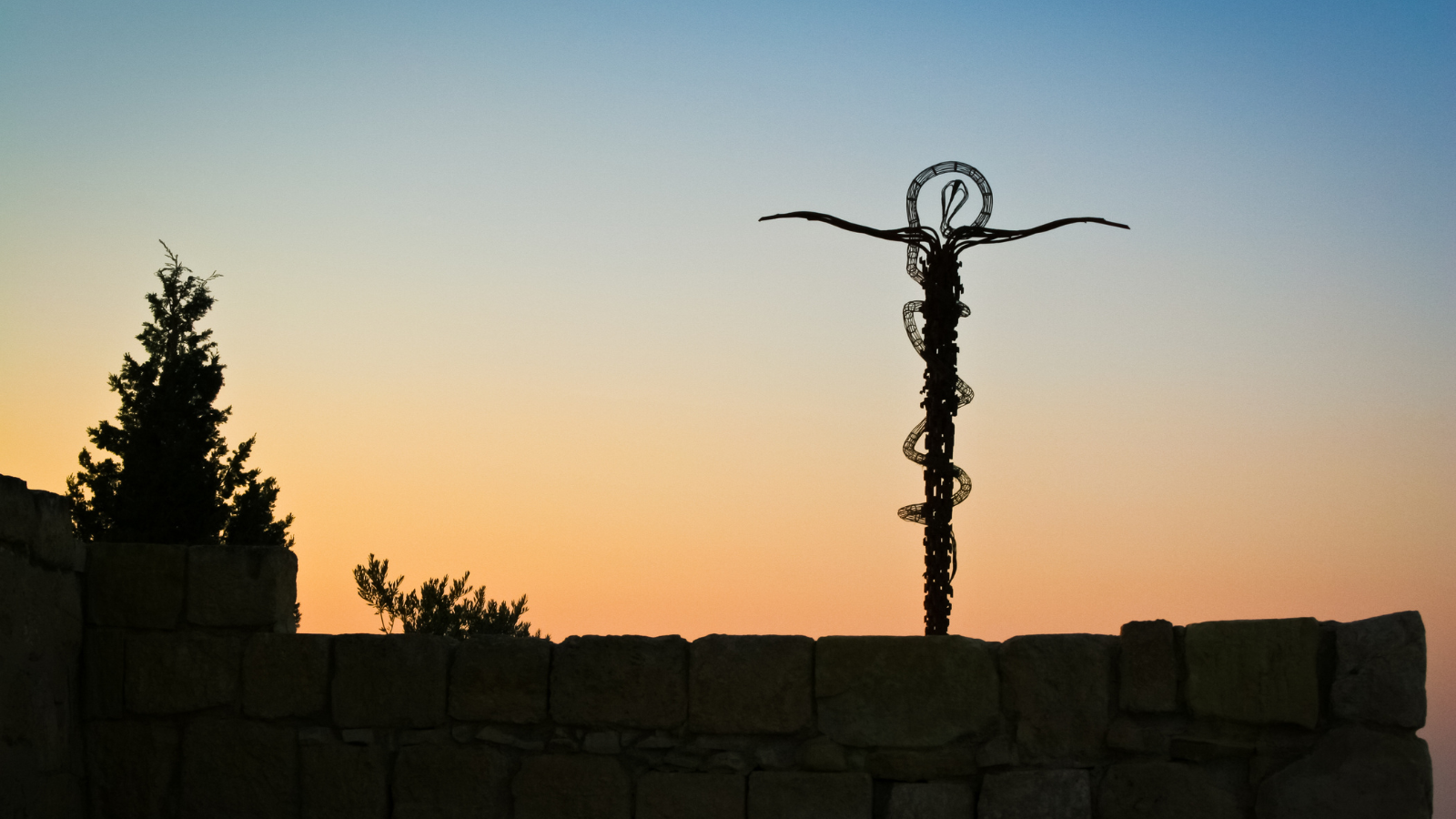 A view of the Serpant Statue at 5. Mount Nebo, Jordan at sunset.