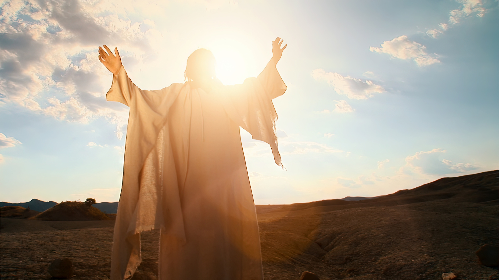 An image of Jesus standing in sunlight.