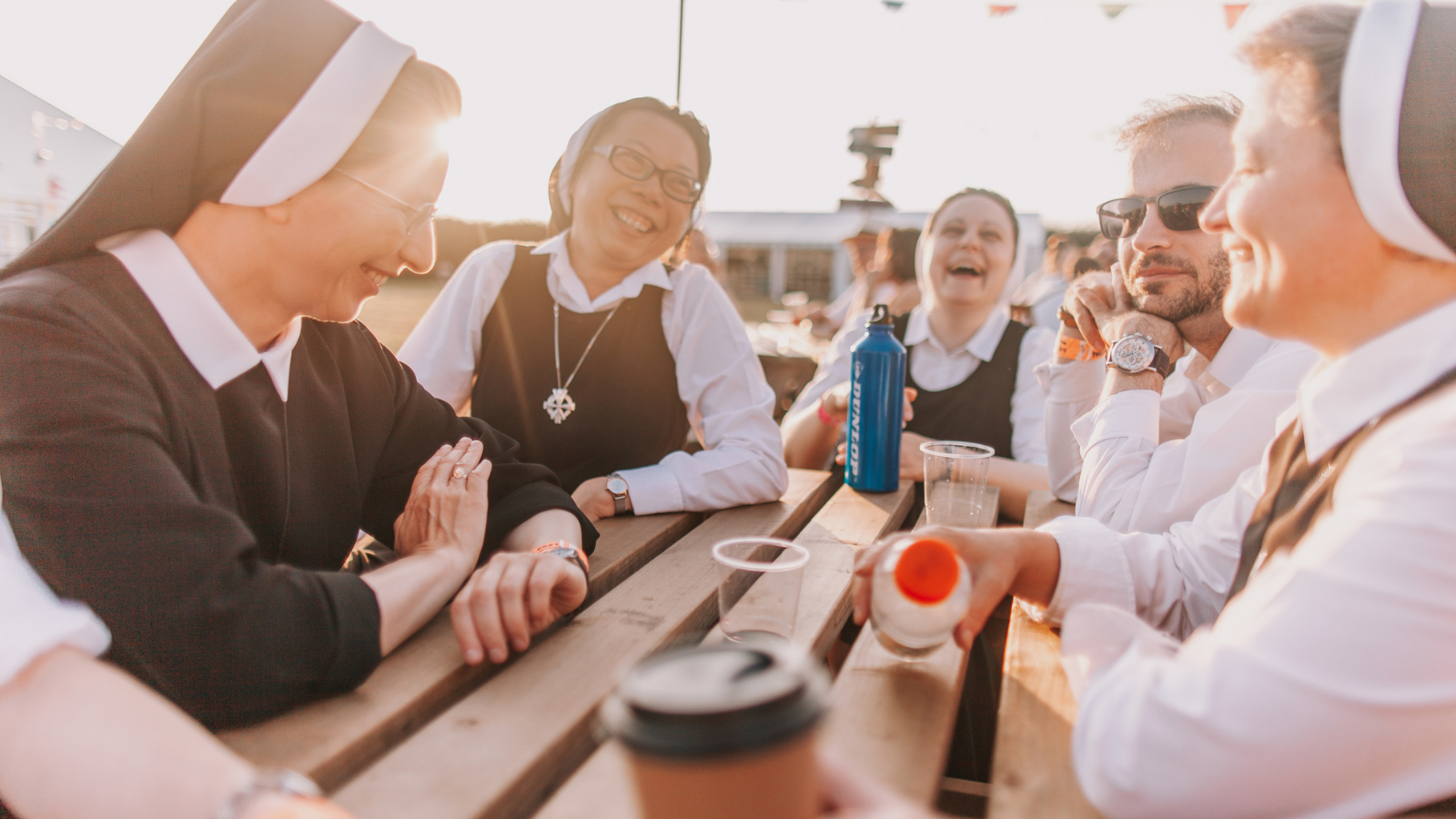 A group of nuns sitting at a table.