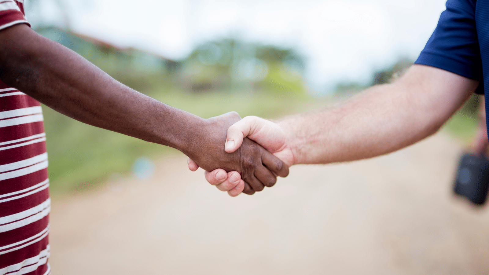 Two people shaking hands.