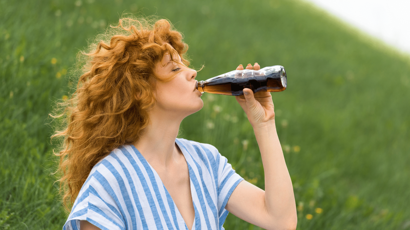 Woman drinking soda