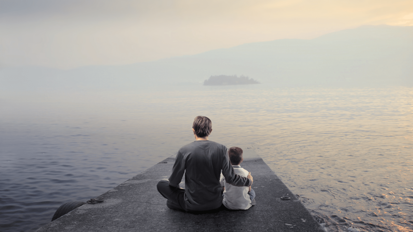 man with boy on a pier