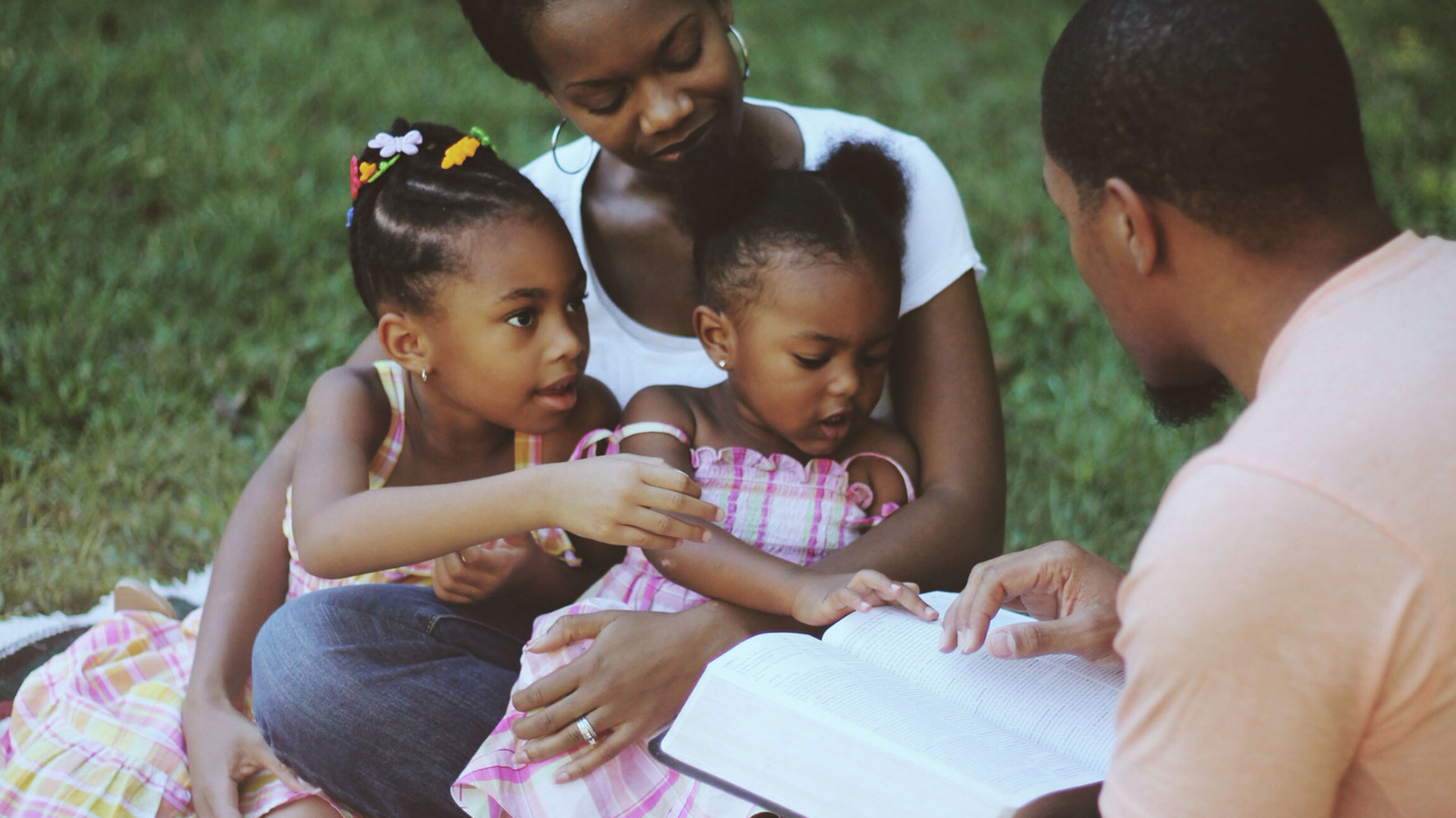 A family reading the bible together.