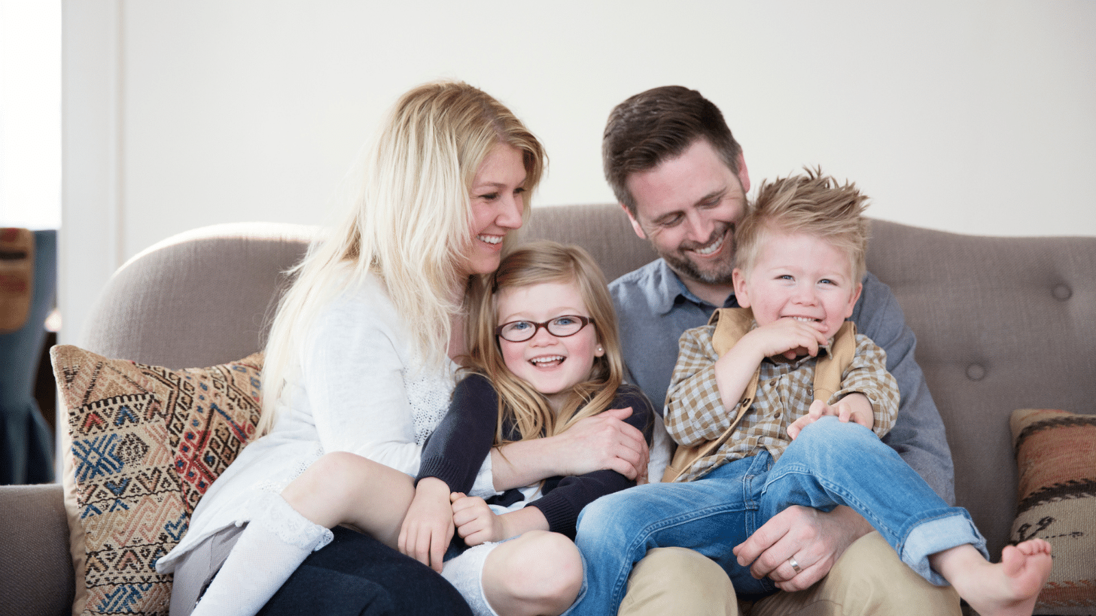 A family sitting together and smiling.