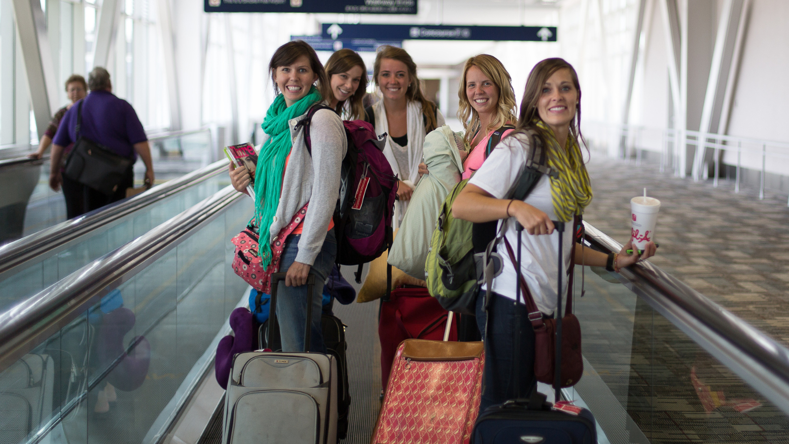 women traveling in airport