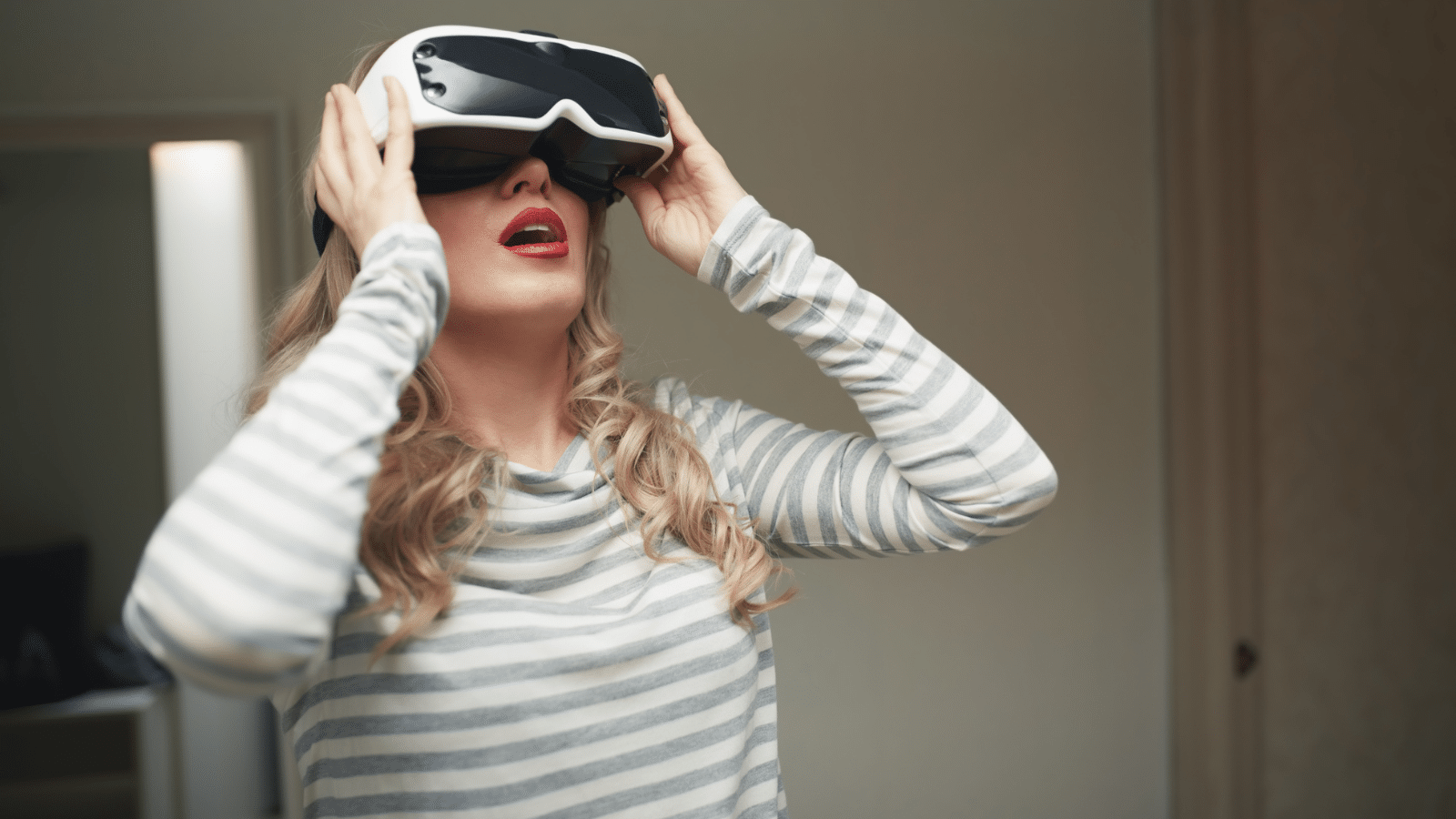 A woman using a virtual reality headset.