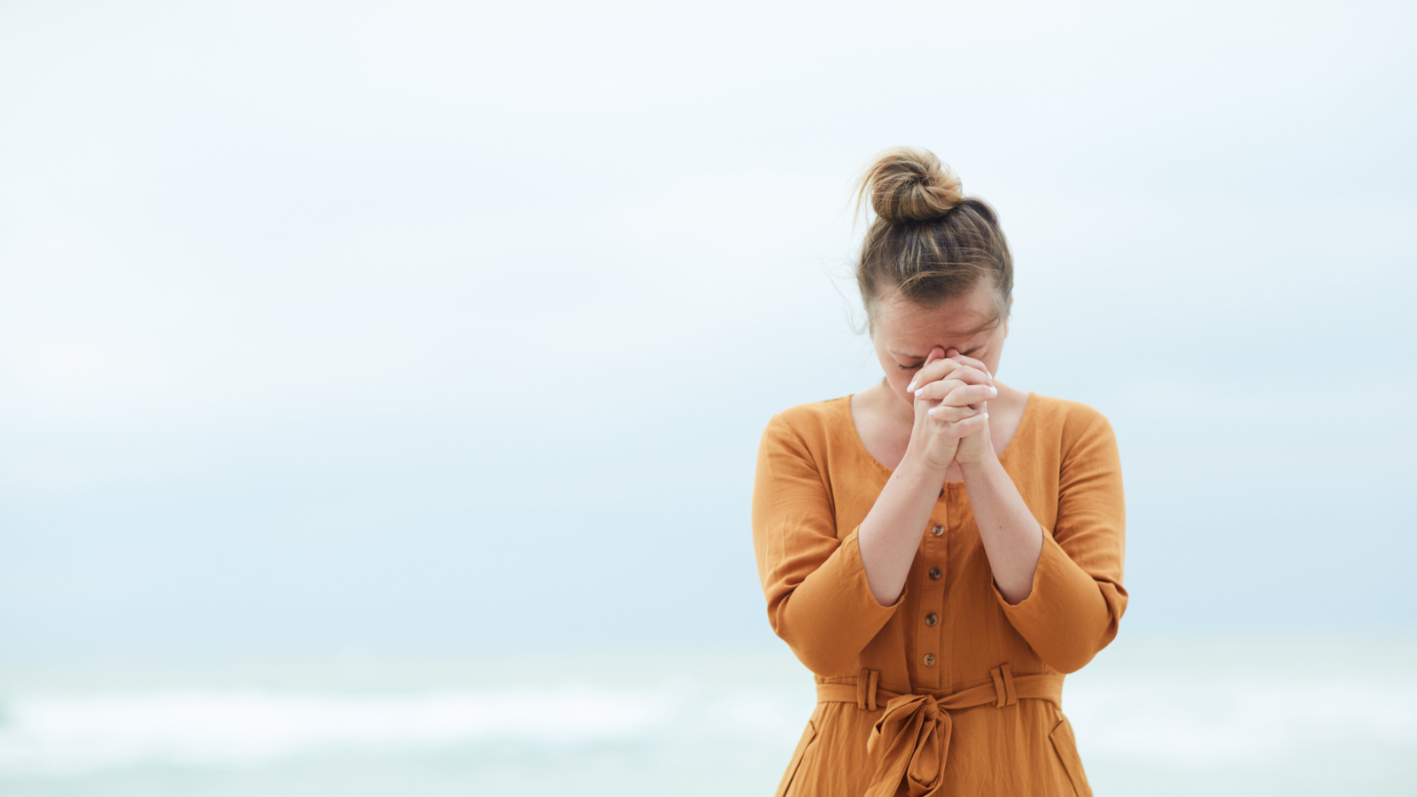 woman praying alone