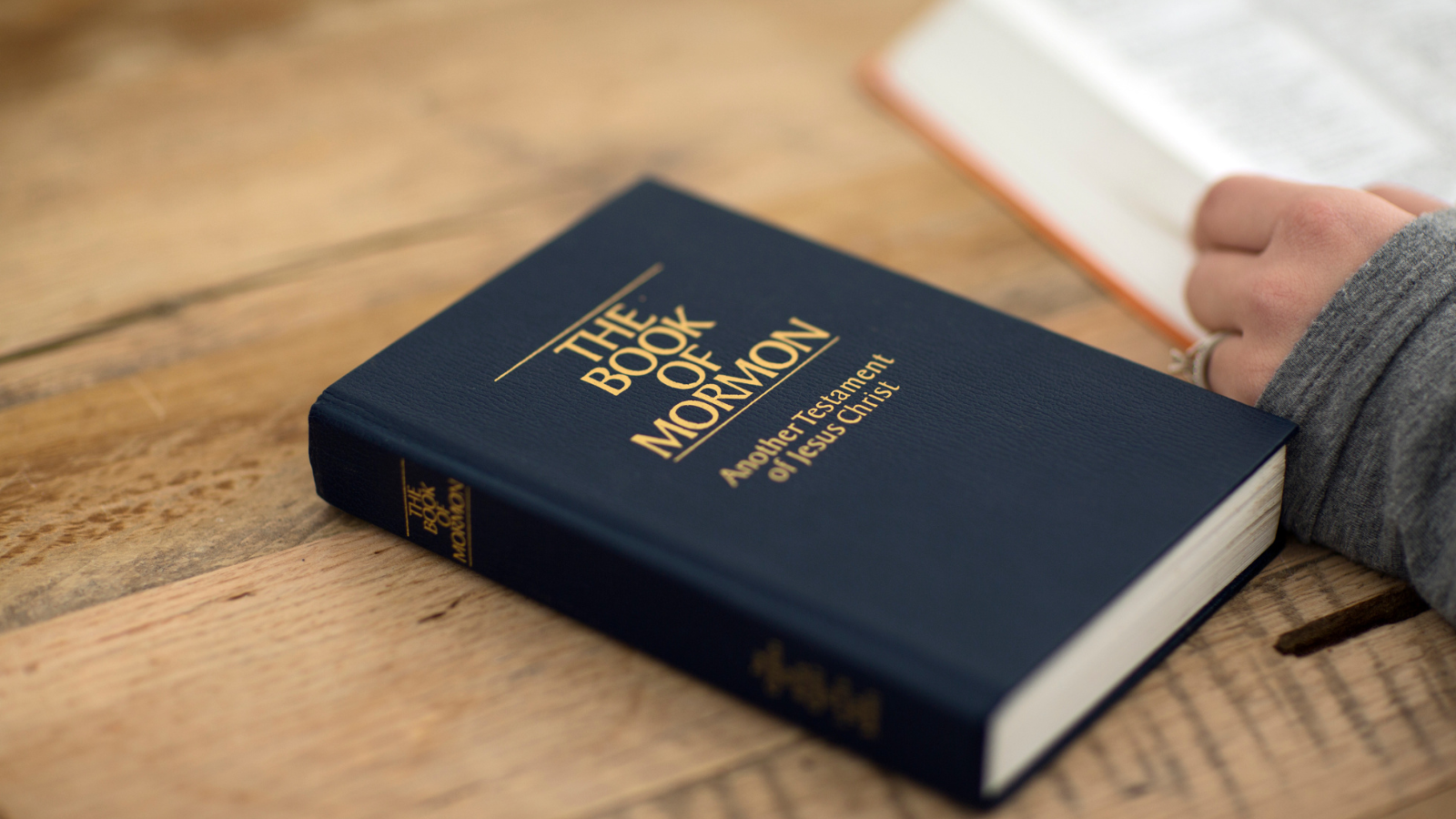 The Book of Mormon on a table.