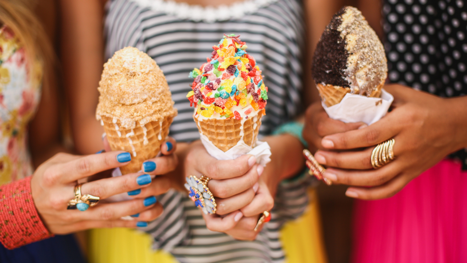 3 women holding ice cream cones