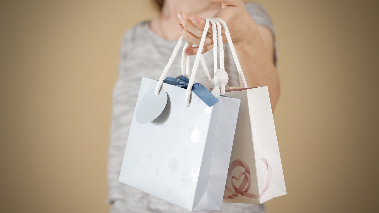 Woman holding two gift bags