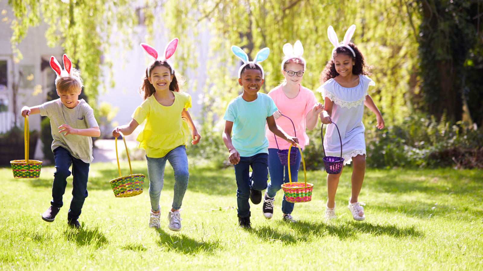 Group of kids holding baskets for egg hunt