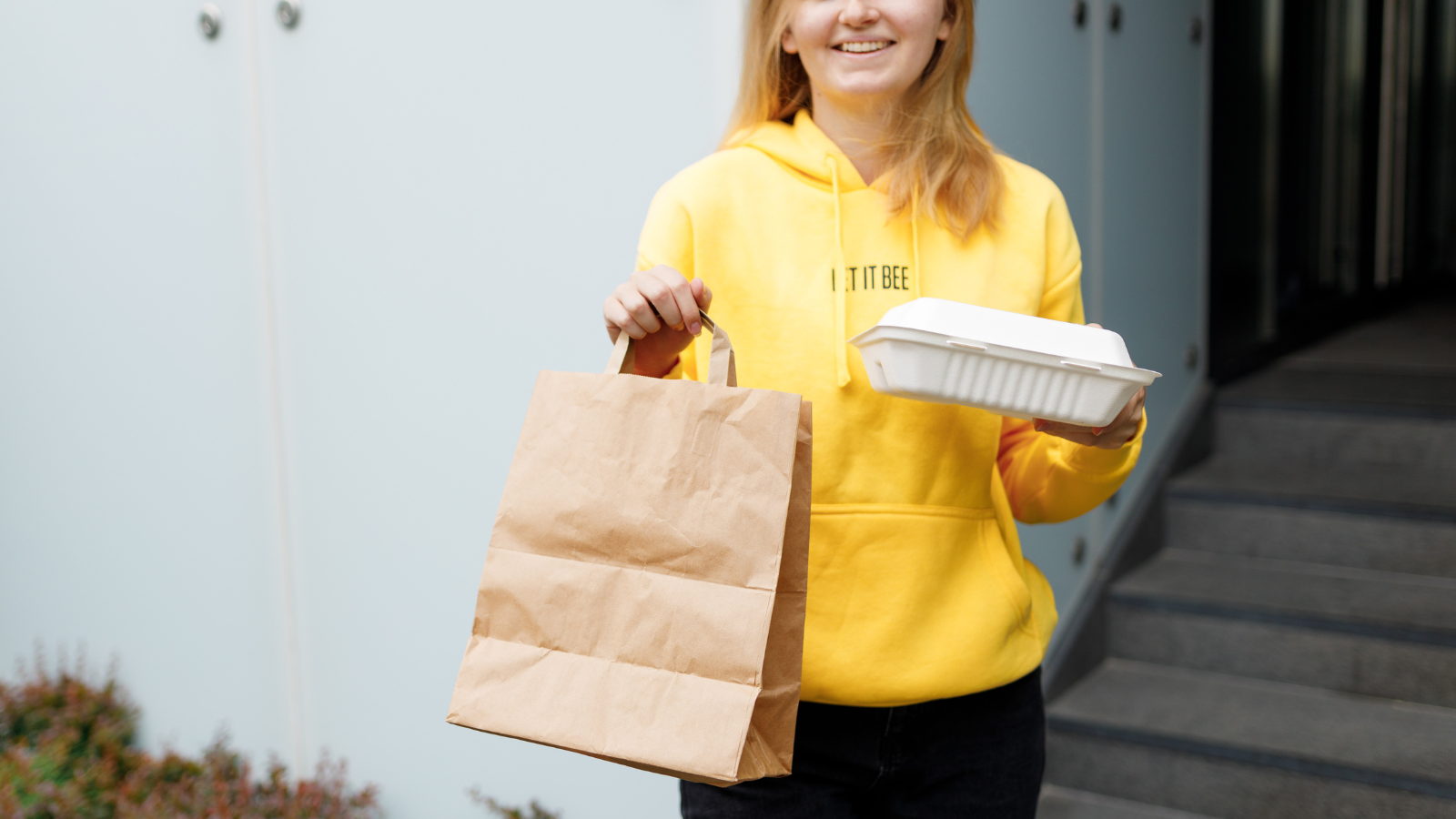 Woman with food bags in her hand