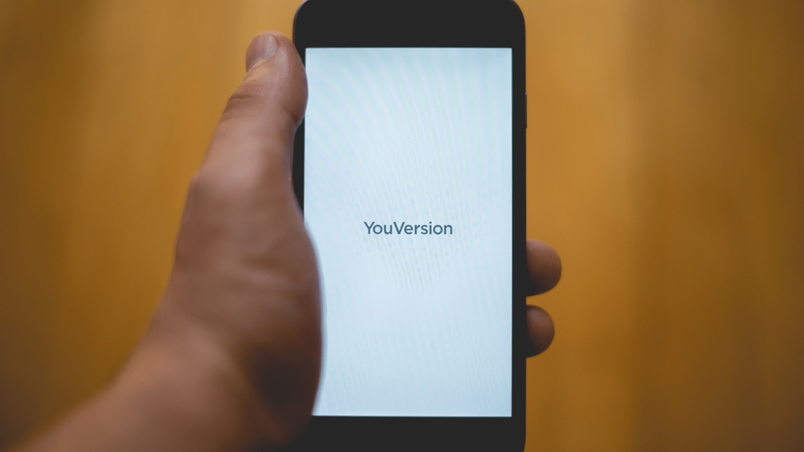 phone with youversion logo